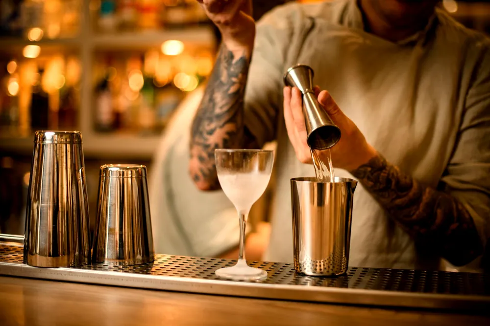 Measuring a cocktail with a jigger